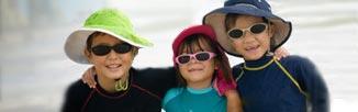 Children in sun safe hats and glasses"