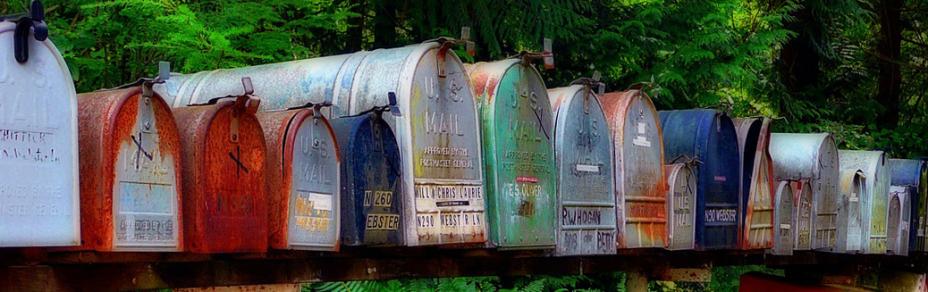 A row of rusty mailboxes