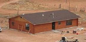 New wood home built to replace contaminated structure
